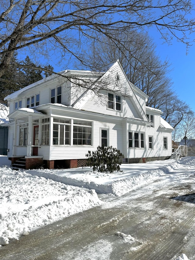 view of front facade with a sunroom