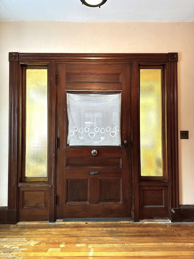 doorway featuring wood finished floors