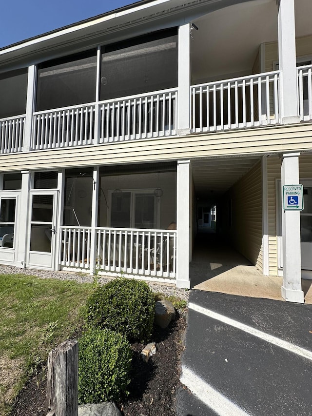 view of home's exterior featuring a carport