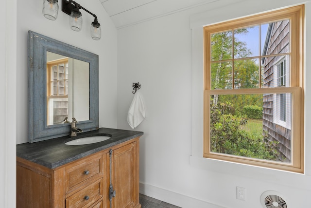 463 Back Meadow Rd, Damariscotta, ME 04543 - bathroom with vanity, lofted ceiling, and baseboards
