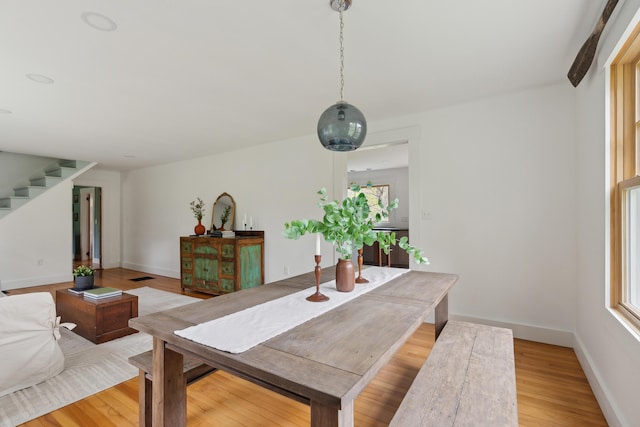 463 Back Meadow Rd, Damariscotta, ME 04543 - dining room featuring stairs, light wood-style flooring, healthy amount of natural light, and baseboards