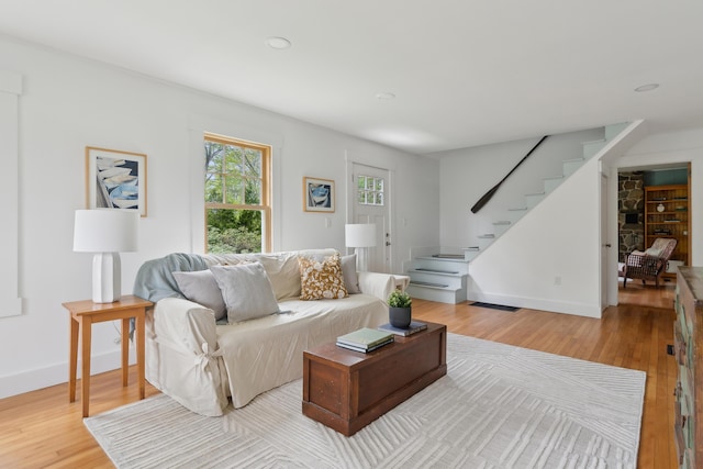 463 Back Meadow Rd, Damariscotta, ME 04543 - living room with light wood-type flooring, stairs, baseboards, and recessed lighting