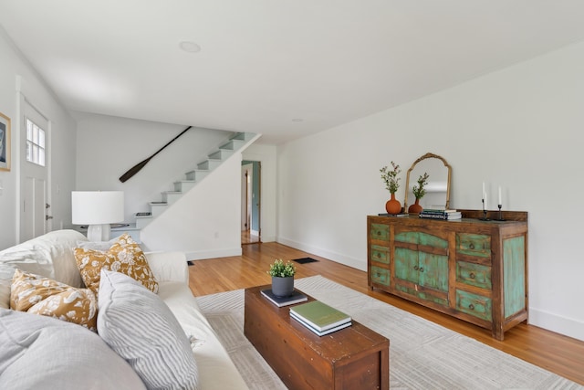 463 Back Meadow Rd, Damariscotta, ME 04543 - living area featuring stairway, wood finished floors, and baseboards