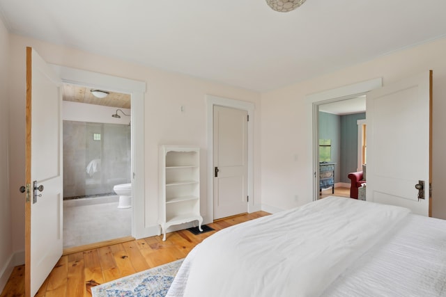 463 Back Meadow Rd, Damariscotta, ME 04543 - bedroom featuring light wood-style flooring, ensuite bathroom, and baseboards