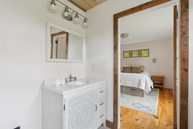 463 Back Meadow Rd, Damariscotta, ME 04543 - ensuite bathroom with vanity and wood finished floors