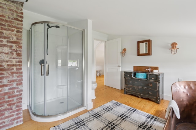 463 Back Meadow Rd, Damariscotta, ME 04543 - bathroom featuring wood finished floors, a stall shower, and toilet