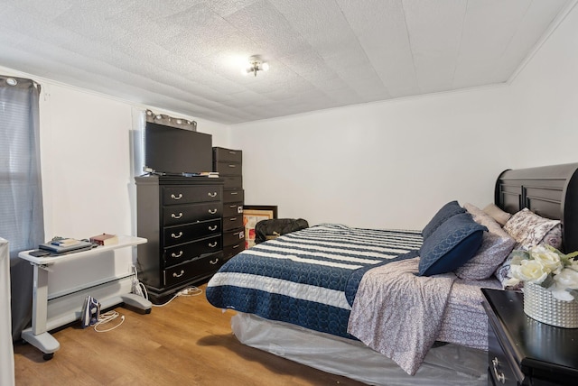 bedroom with wood finished floors