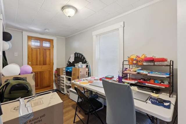 office space with crown molding and wood finished floors