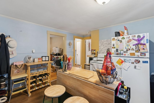 interior space with crown molding and wood finished floors