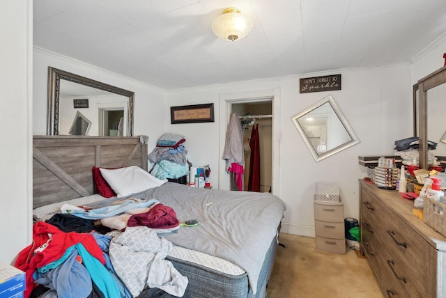 bedroom featuring crown molding and light carpet