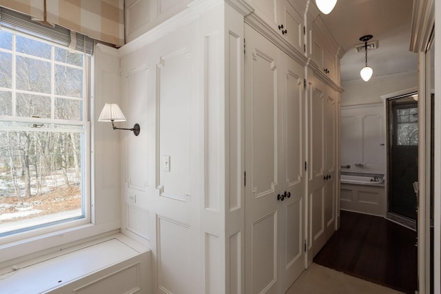 interior space featuring visible vents and crown molding