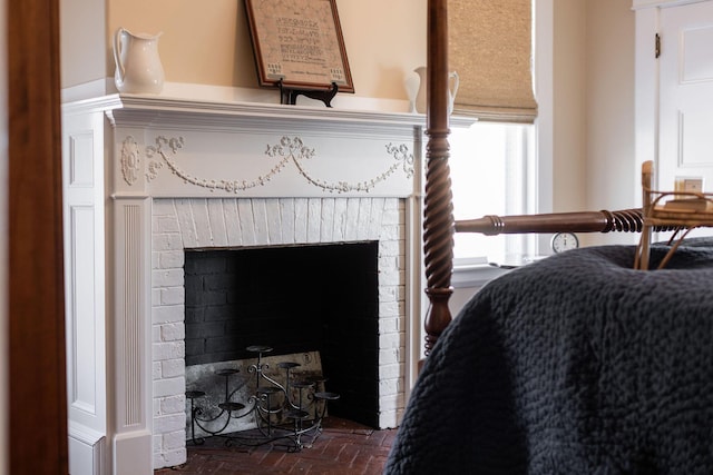 room details featuring a brick fireplace