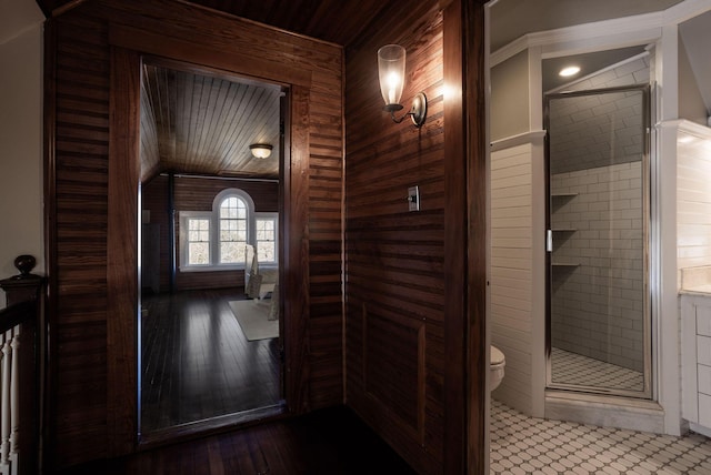 interior space with wooden ceiling and wooden walls