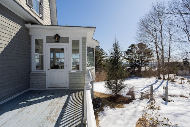 view of snow covered property entrance