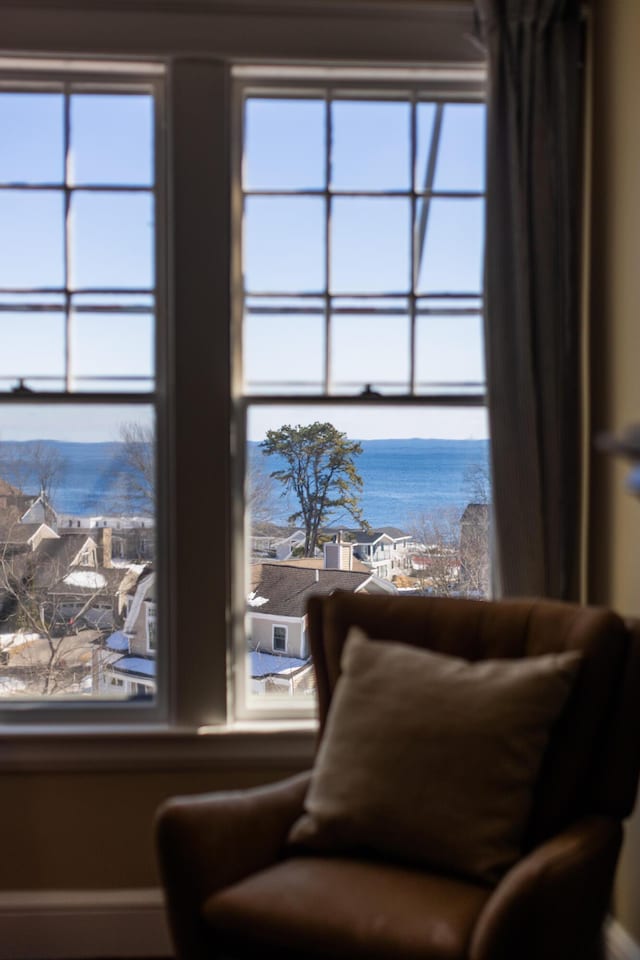 sitting room featuring a water view