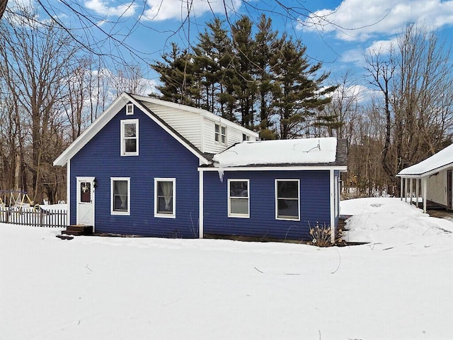 view of snow covered house