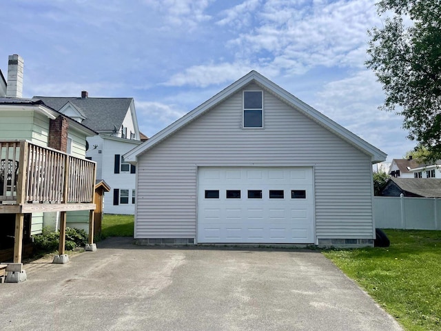 exterior space featuring fence and aphalt driveway