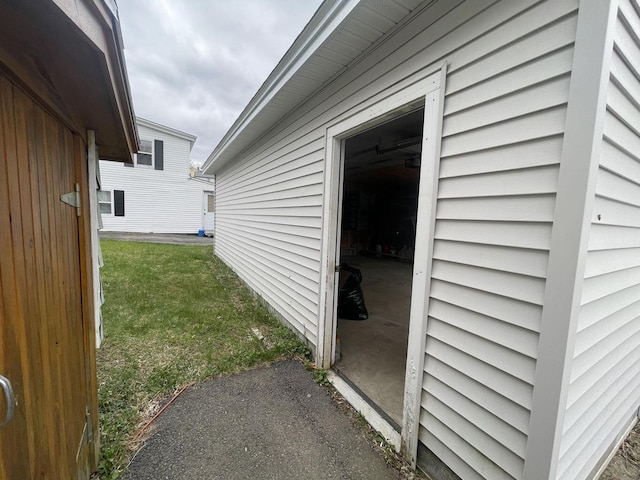 view of side of home featuring a yard