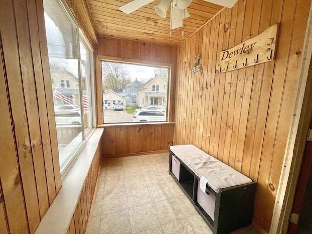 mudroom featuring a ceiling fan, wood ceiling, wooden walls, and tile patterned floors