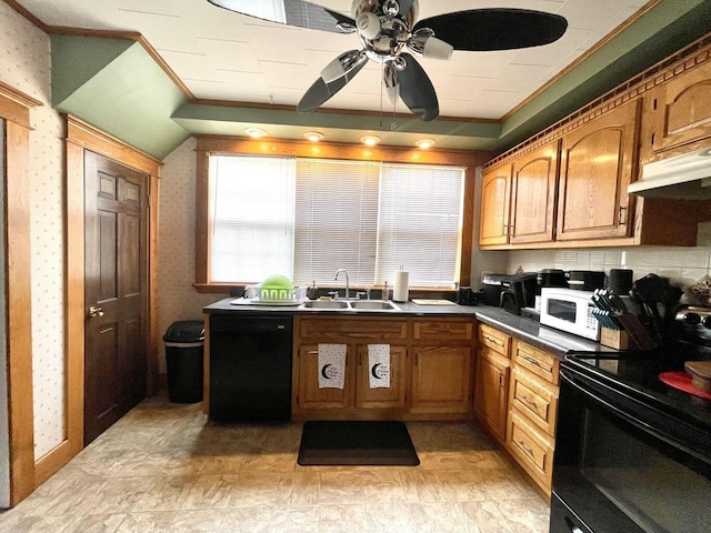 kitchen with under cabinet range hood, a sink, black appliances, dark countertops, and wallpapered walls