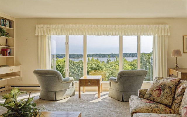 living room featuring a water view and carpet flooring