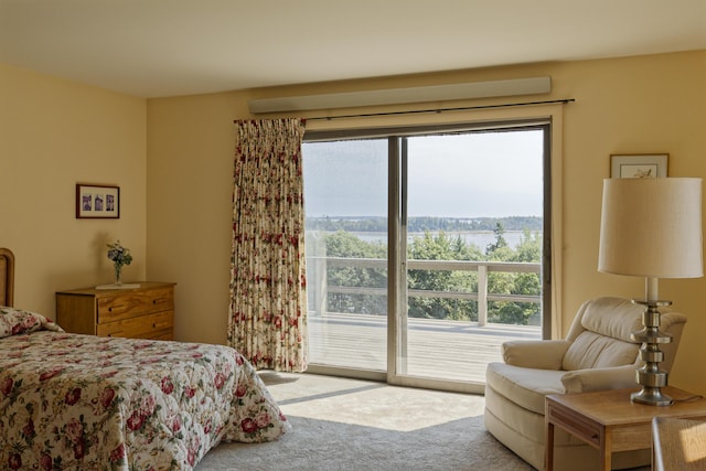 carpeted bedroom featuring access to outside