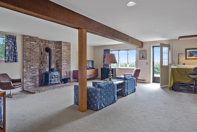 carpeted living area with baseboard heating, a wood stove, beam ceiling, and recessed lighting