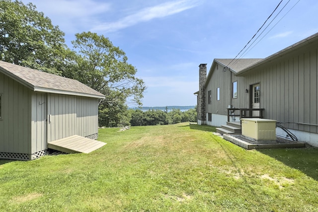 view of yard with an outbuilding and a storage shed