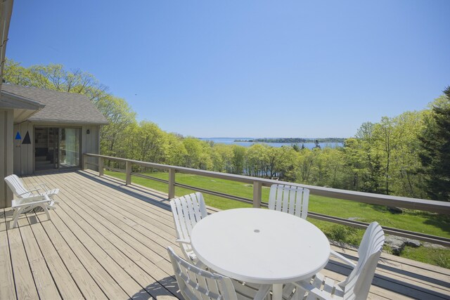 153 Back Shore Rd, Bristol, ME 04564 - wooden terrace with a water view, a lawn, and outdoor dining area