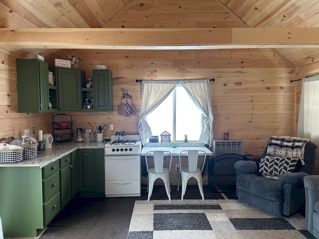 kitchen with green cabinetry, white gas stove, and wooden walls