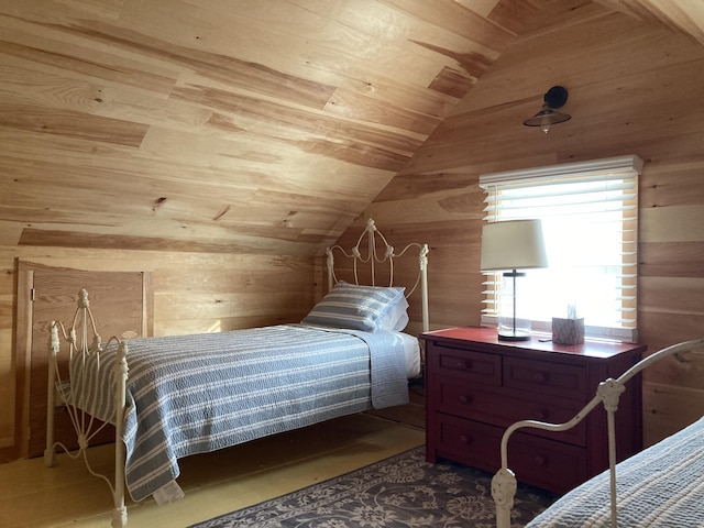 bedroom with lofted ceiling, wooden walls, and wooden ceiling