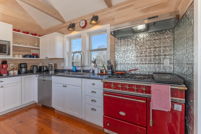 kitchen featuring wood finished floors, lofted ceiling with beams, a sink, under cabinet range hood, and dishwasher