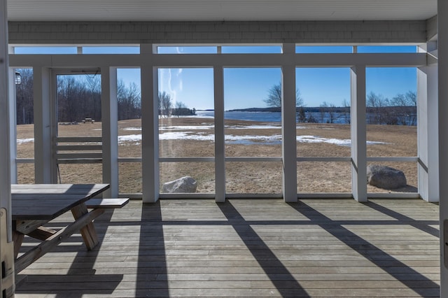 unfurnished sunroom with plenty of natural light