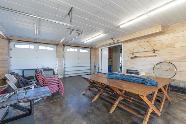 garage featuring wooden walls