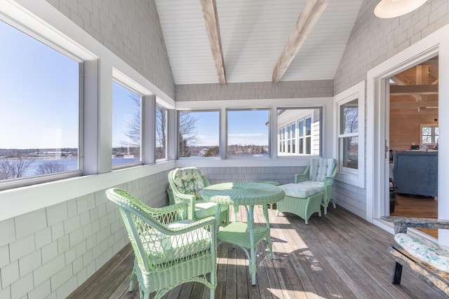 sunroom / solarium with lofted ceiling with beams