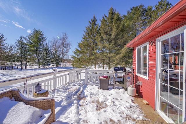 view of snow covered deck