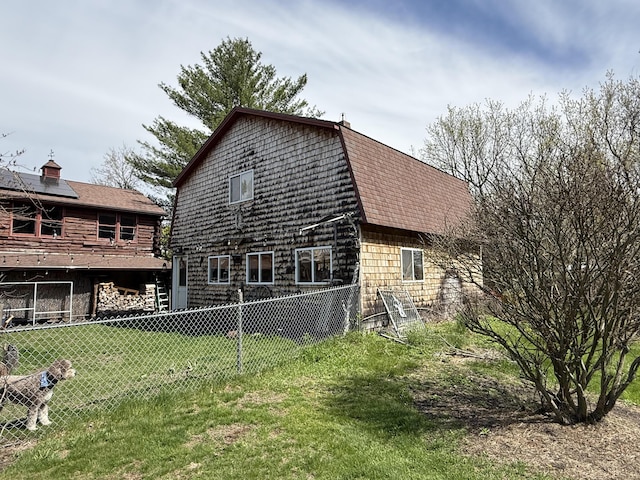 1 Angies Dr, Waterville, ME 04901 - back of house with fence, a shingled roof, and a lawn
