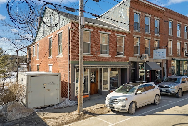 townhome / multi-family property featuring brick siding