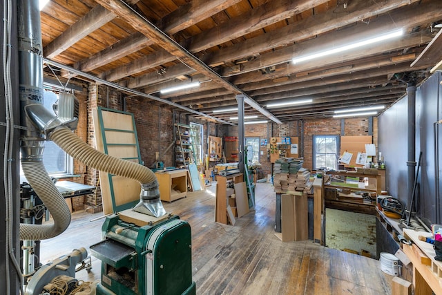 below grade area with wood-type flooring and a workshop area