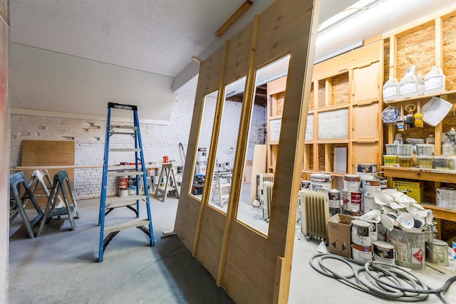 interior space featuring brick wall