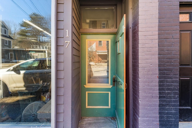 entrance to property with brick siding