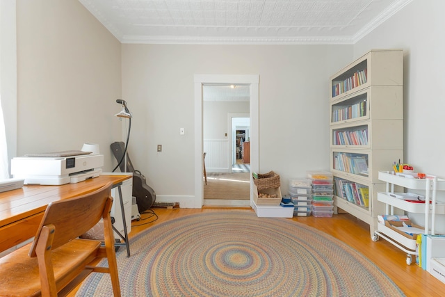 office featuring wood finished floors and crown molding