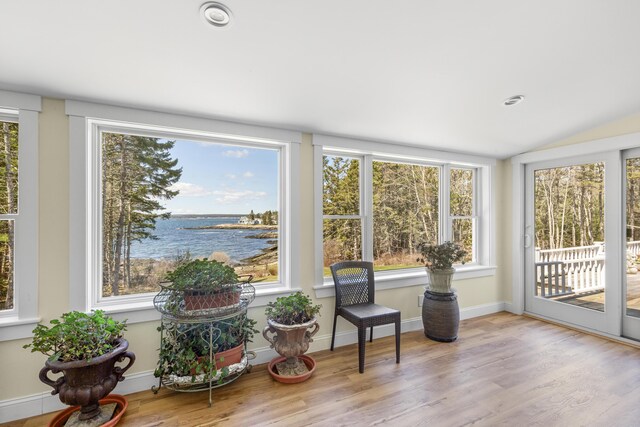 825 Hendricks Hill Rd, Southport, ME 04576 - sunroom with a water view, wood finished floors, vaulted ceiling, and recessed lighting