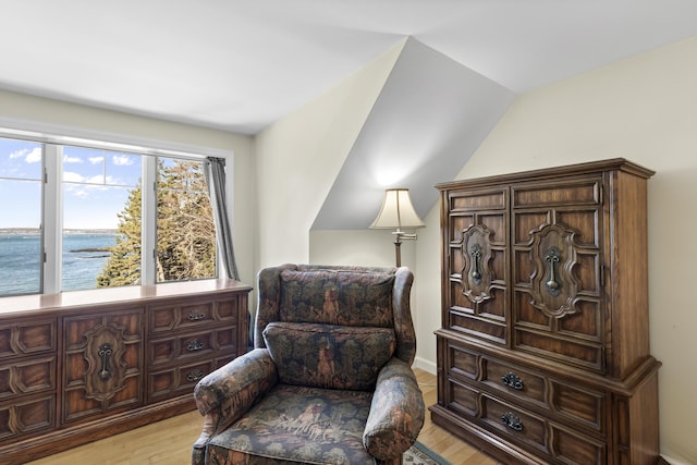 825 Hendricks Hill Rd, Southport, ME 04576 - living area featuring light wood-type flooring, a water view, and lofted ceiling