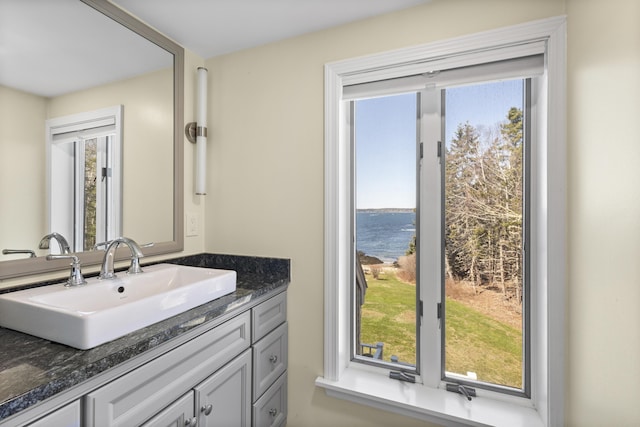 825 Hendricks Hill Rd, Southport, ME 04576 - bathroom with a water view and vanity