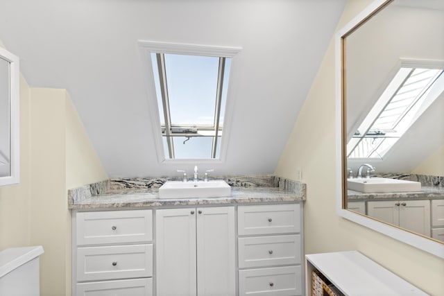 825 Hendricks Hill Rd, Southport, ME 04576 - bathroom featuring a skylight, vanity, and toilet