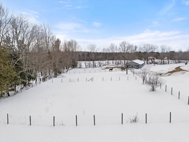 snowy yard with fence