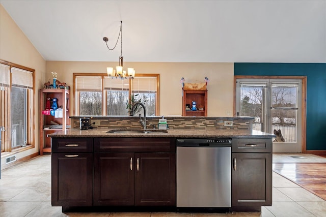 kitchen featuring a wealth of natural light, visible vents, vaulted ceiling, stainless steel dishwasher, and a sink