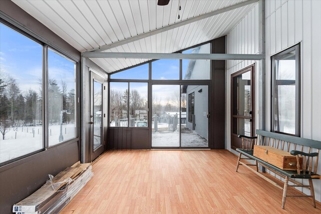 sunroom / solarium with vaulted ceiling with beams and plenty of natural light