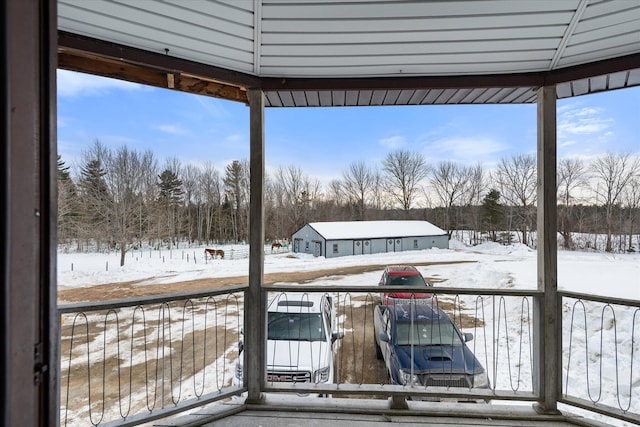 view of snow covered deck